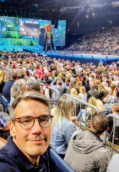 Felix in the crowd at a stadium concert